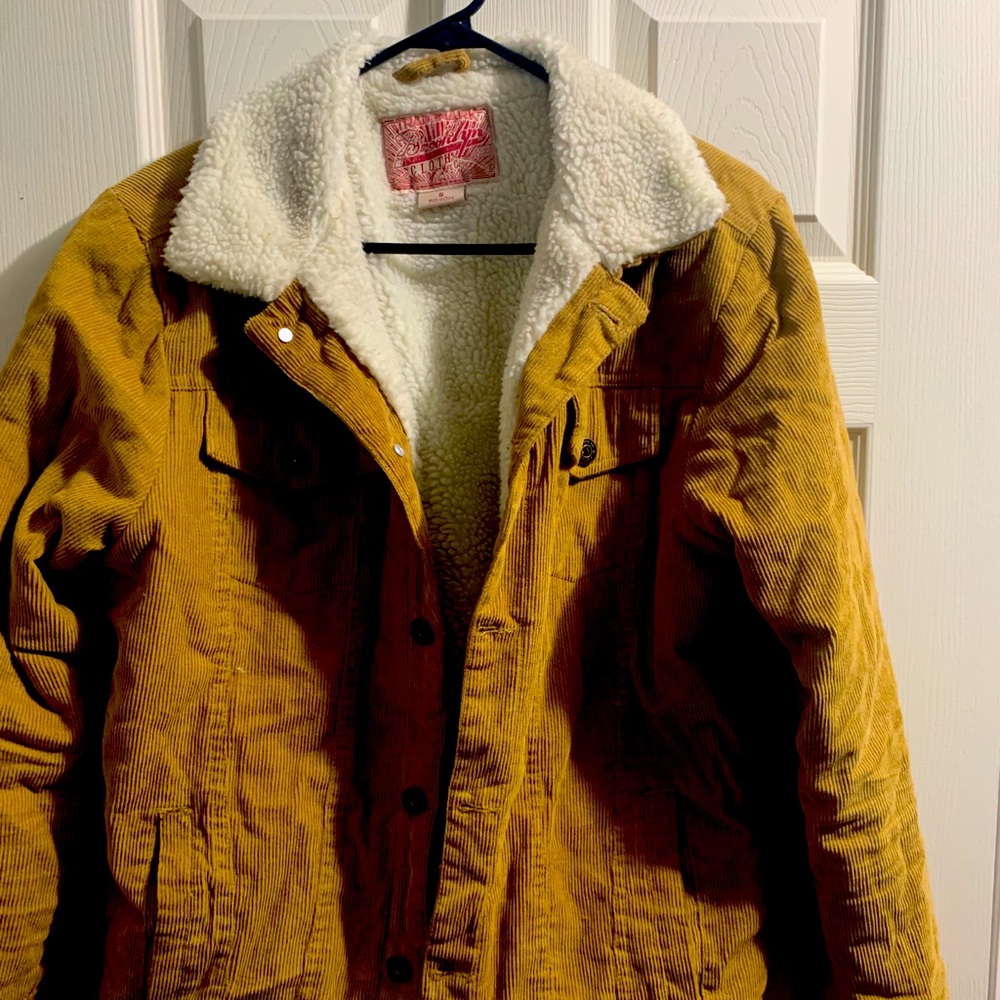 Tan corduroy jacket with white sheep fur
